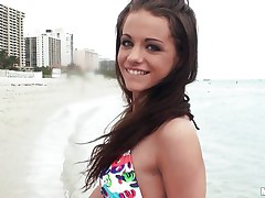 A very hot brunette meets a guy at the beach and after talking for a little while she takes him back to her hotel room where before you know it she's topless, showing off her nice boobs and sucking his fat dick. Will she suck his cock long enough for him to cum all over her pretty young face?